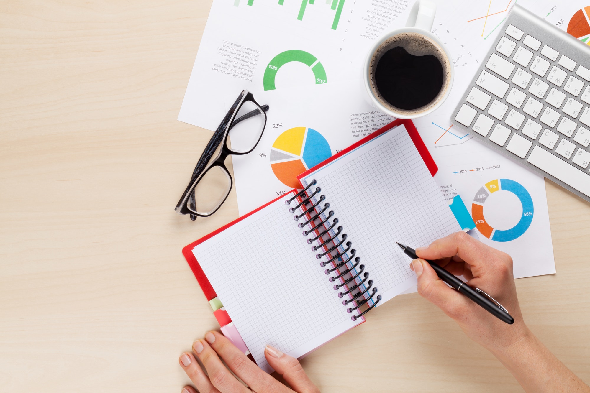 Woman working with reports and charts